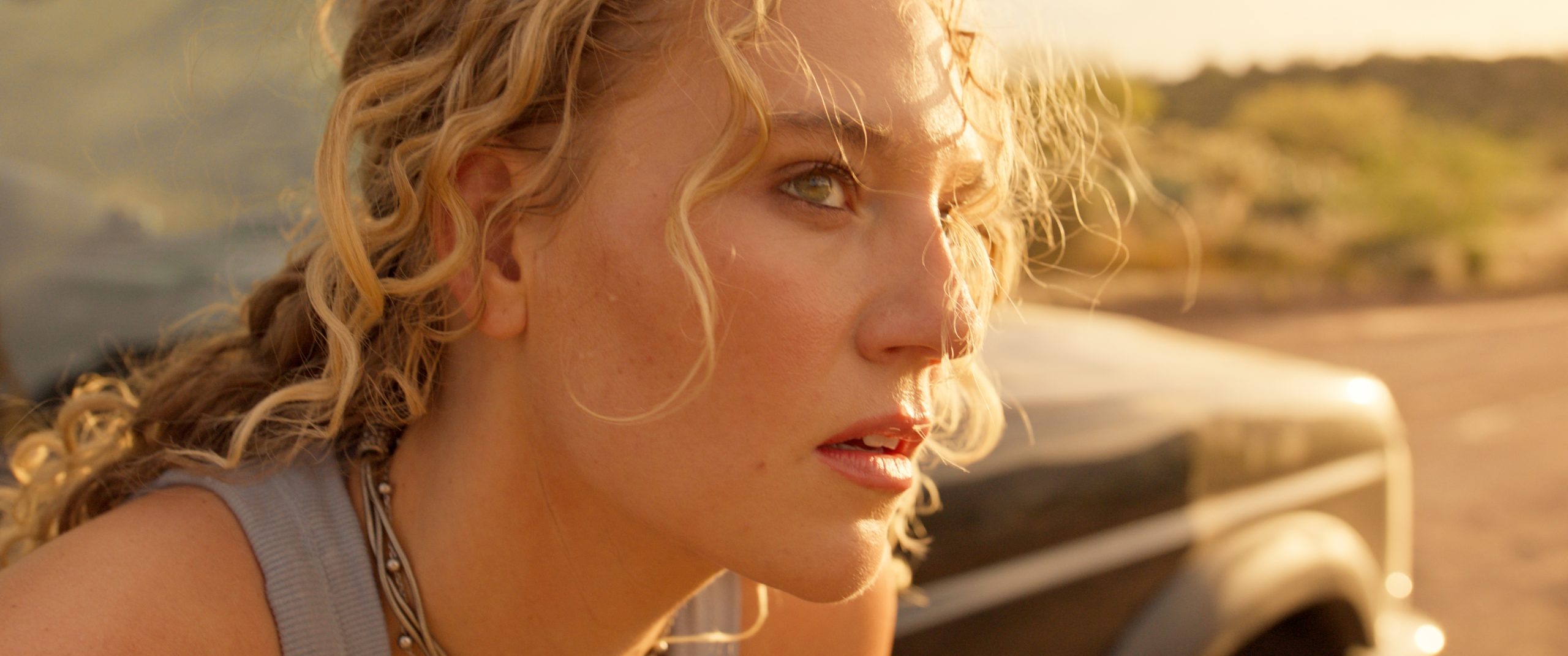 Photo 2- Kat Cunning in STAR PEOPLE (Credit_ Blue Harbor Entertainment) A woman outdoors looking to the side